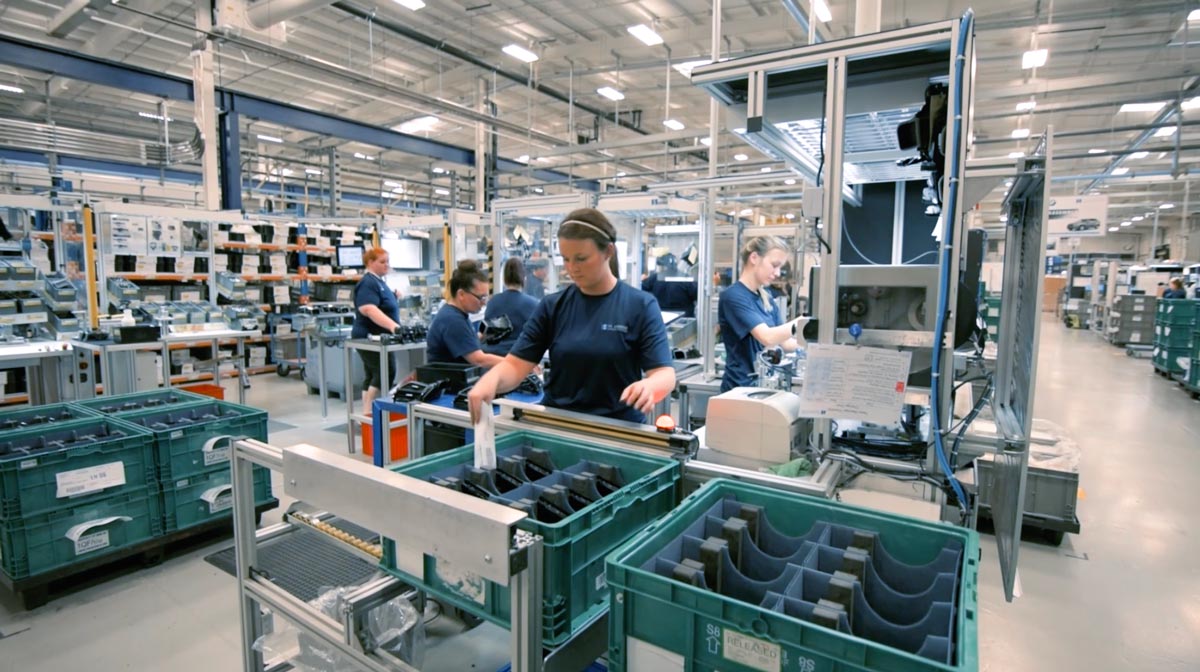 Factory workers with machinery. 