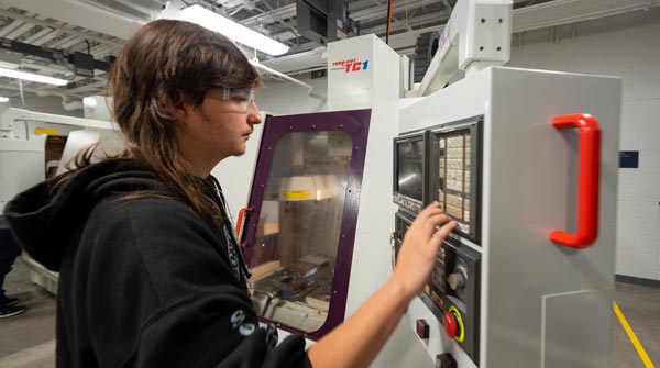 LCRCWC student with CNC machine